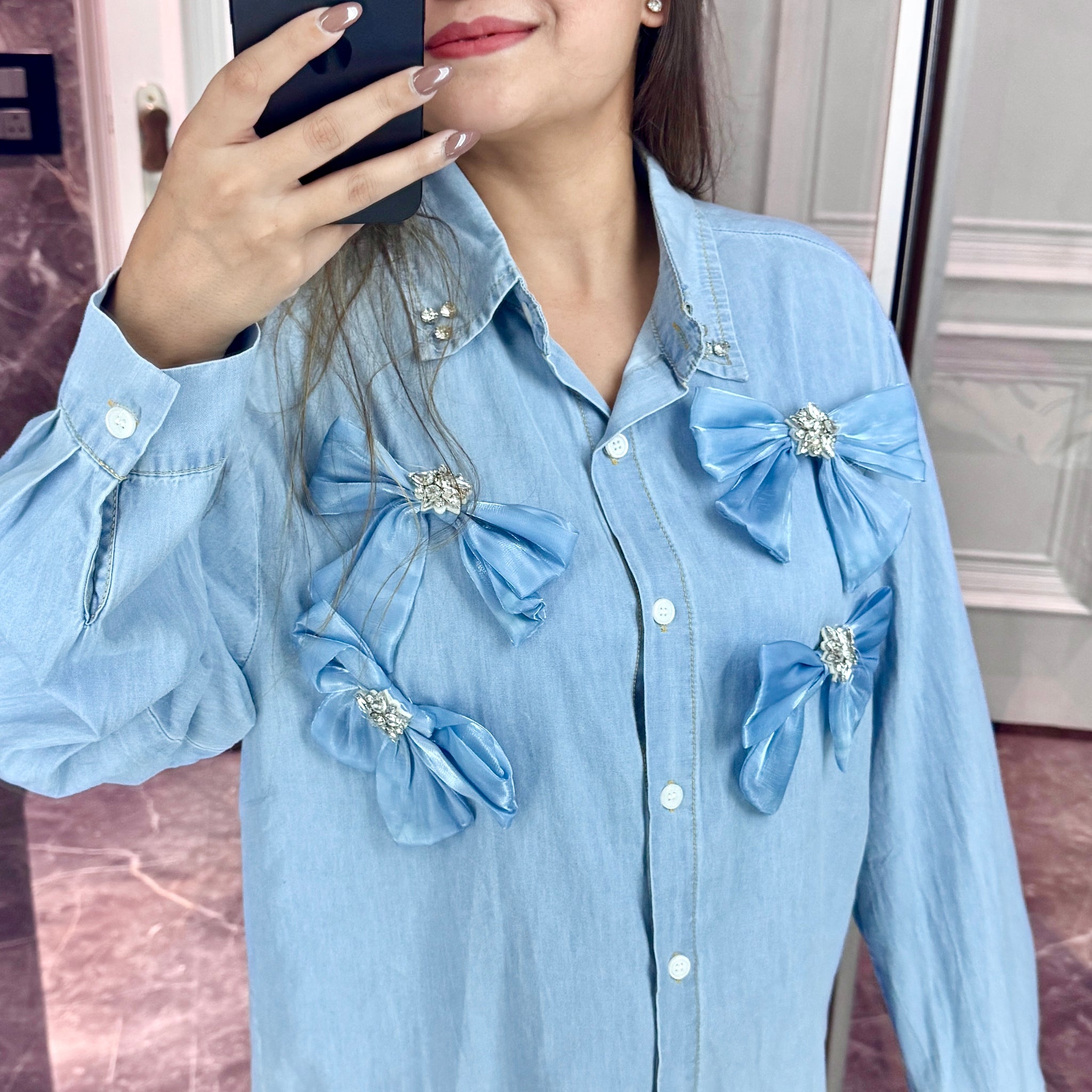 Bow embellished denim shirt